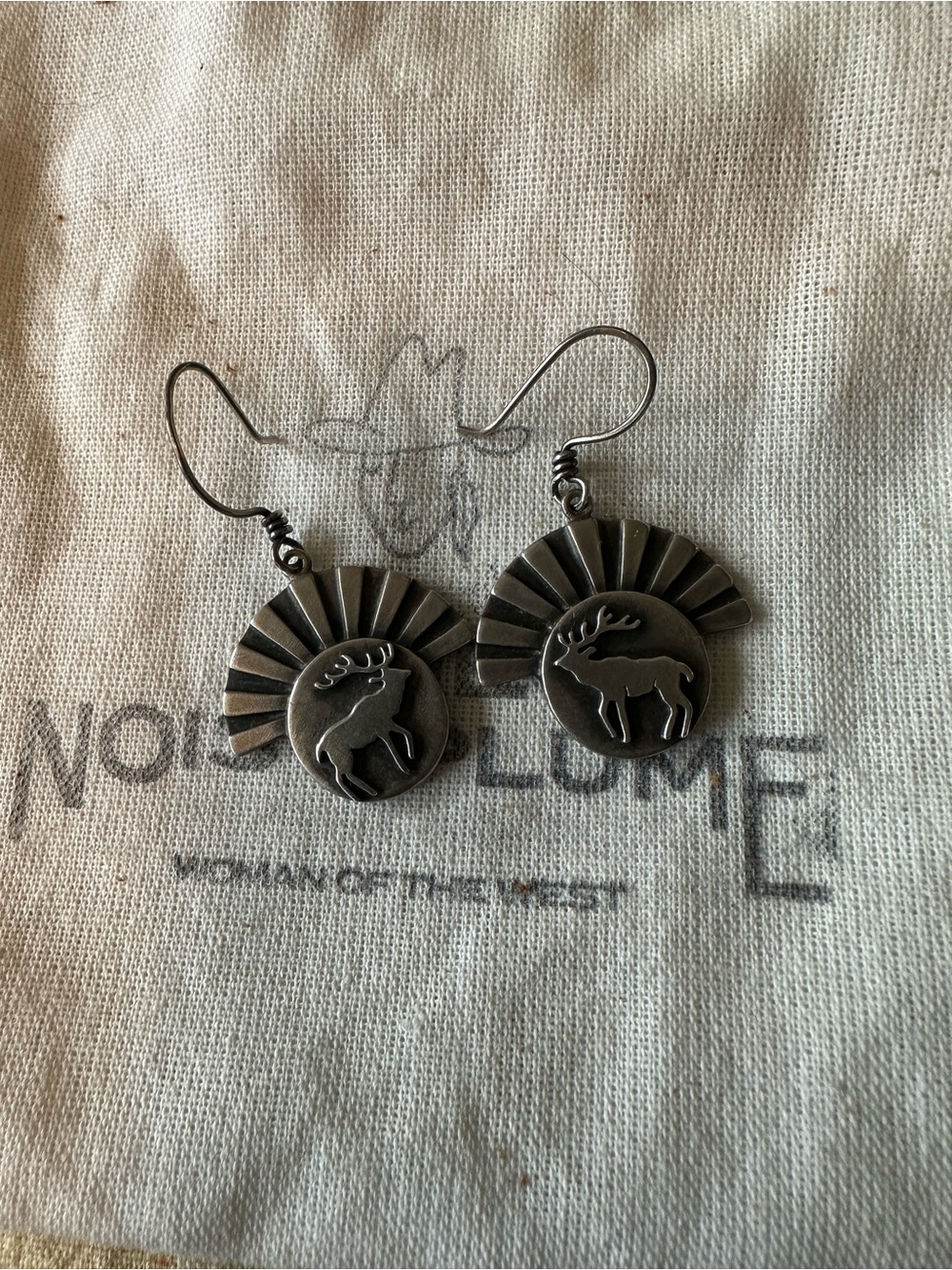 The Noisy Plume At First Light earrings